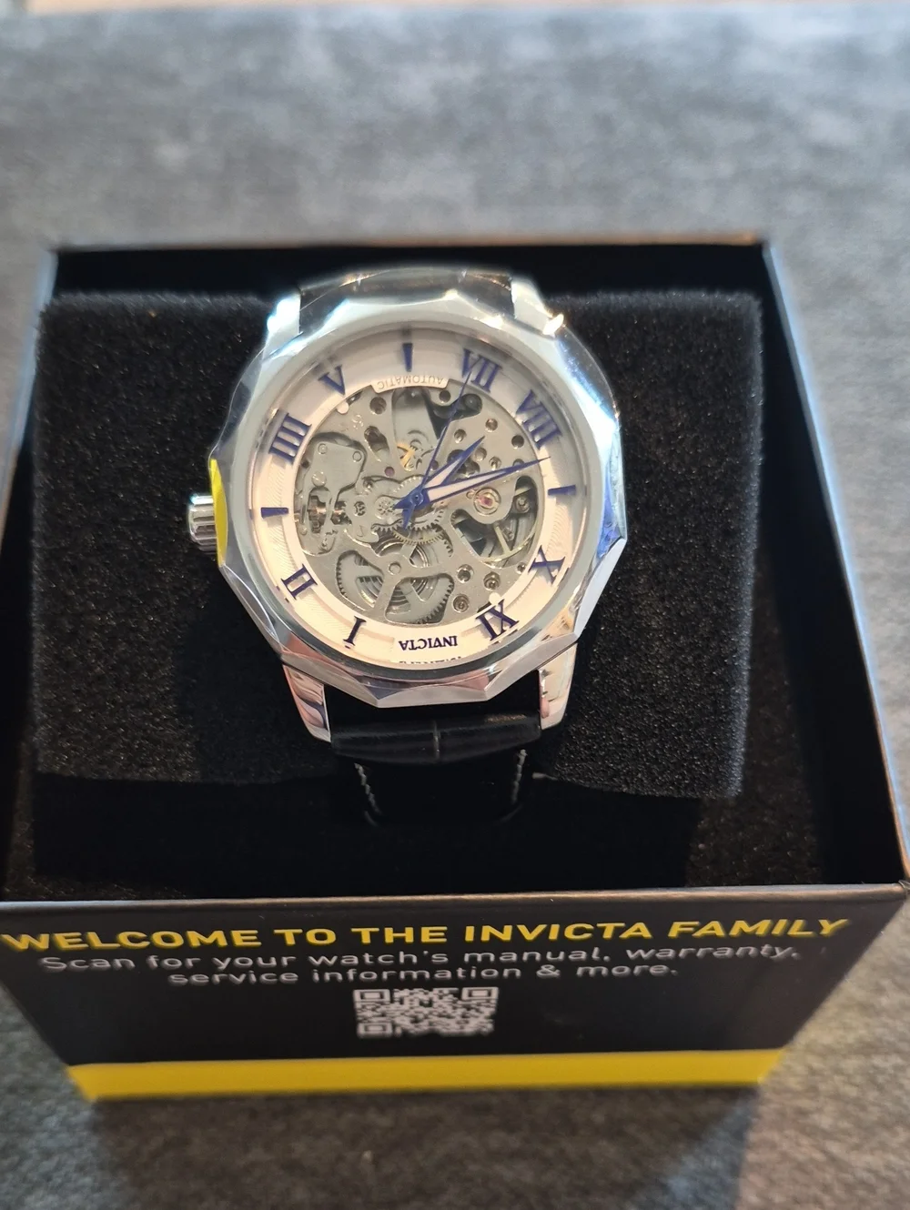 Invicta Silver Skeleton Dial Watch with Blue Hands